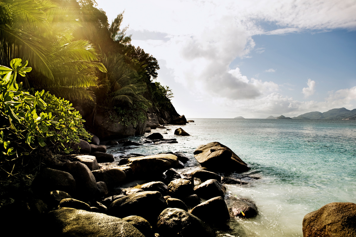 beach at mahe, four seasons, Seychelles, with rocks and trees